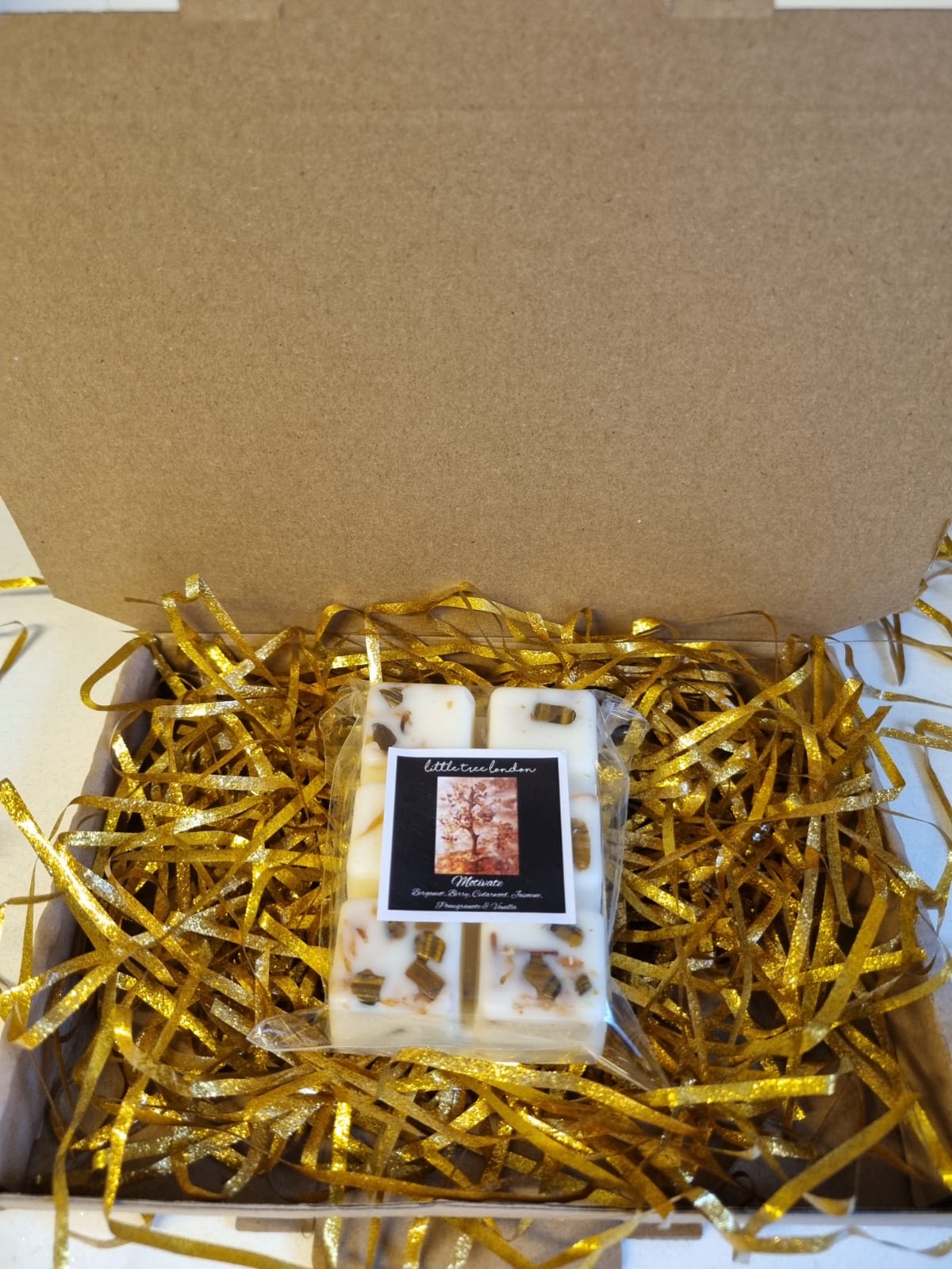 Motivate Luxury wax melts with tiger eye crystals chips. Unique wax melts dried Jasmine.  High fragranced, long lasting.